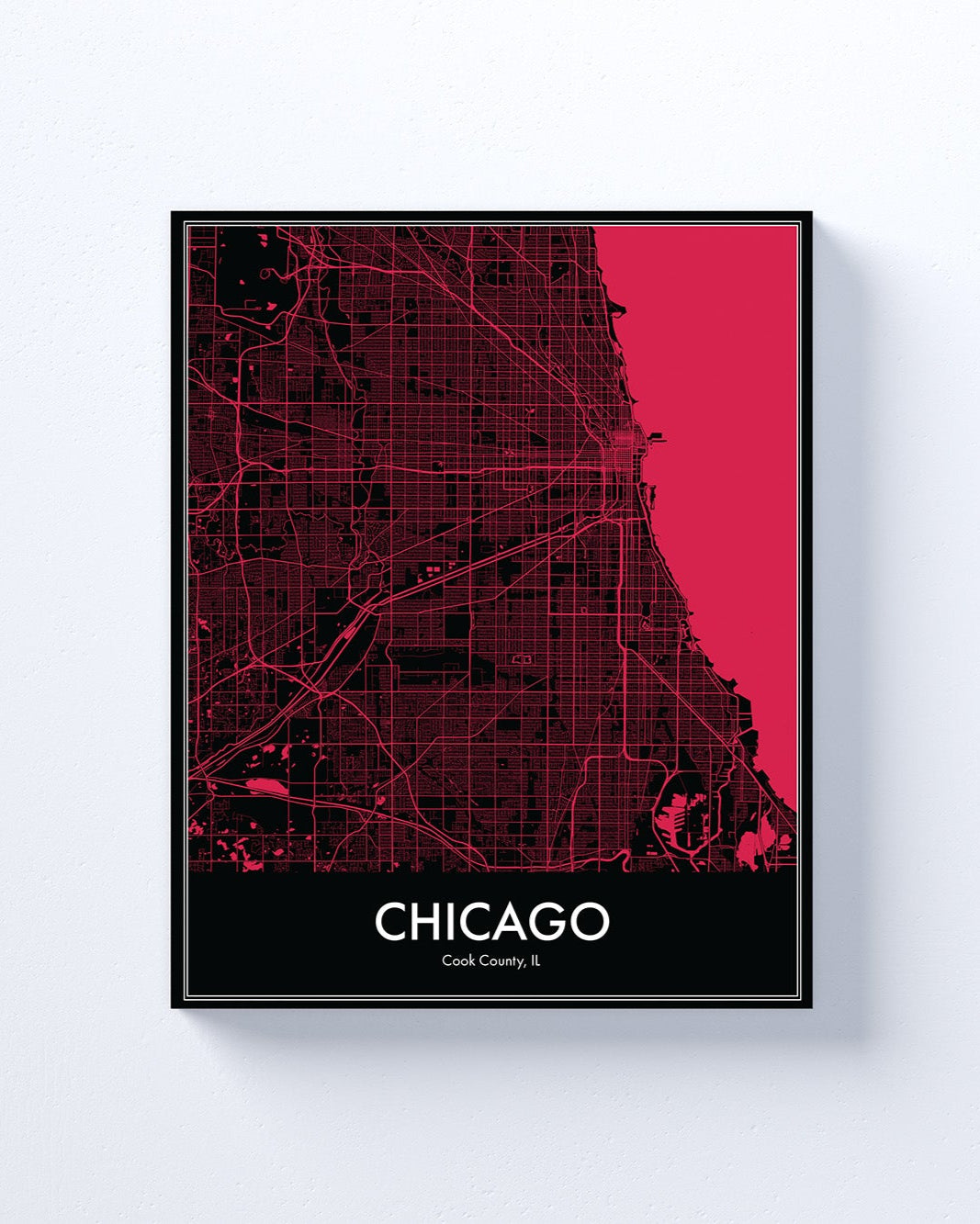 Framed map of Chicago with a black frame and red map details on a white background