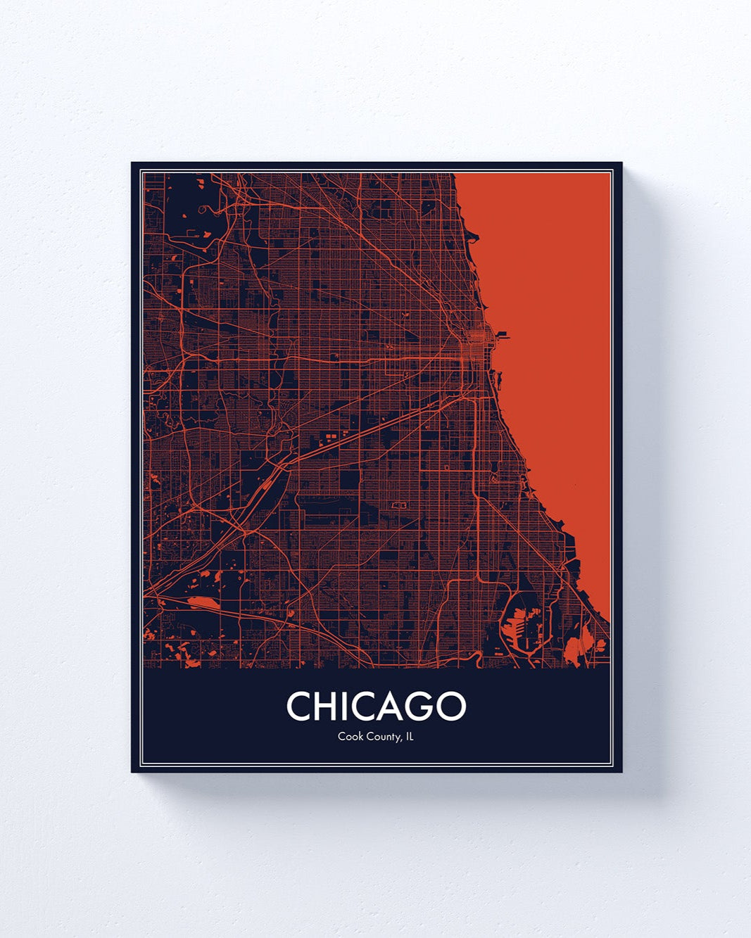 Framed map of Chicago with a red and black color scheme on a white background